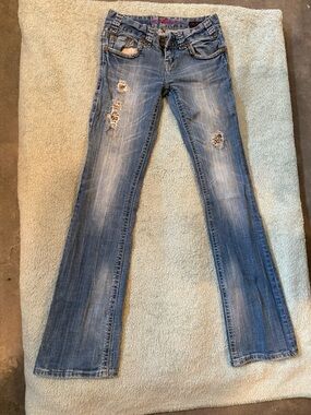 Light Blue Distressed Skinny Jeans with Subtle Flare